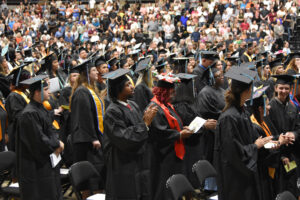 a crowd of graduates at commencement