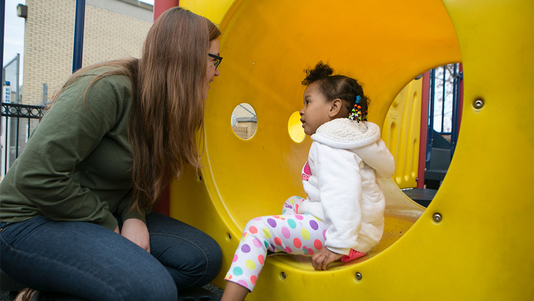 Adult and child on a playground