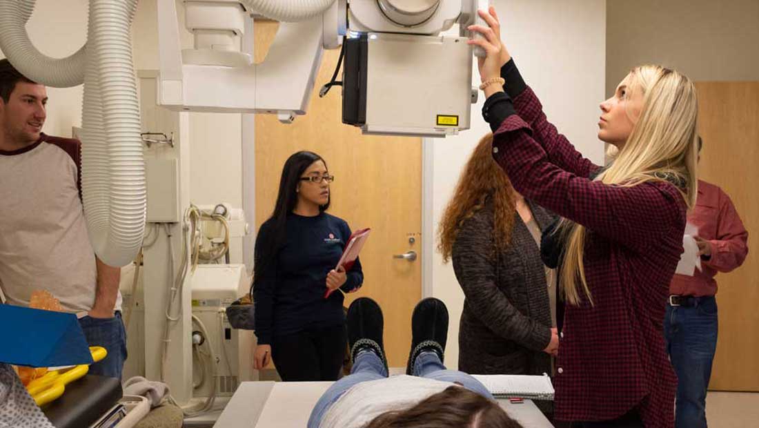 Students using an x-ray machine