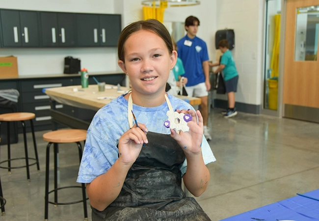 girl painting a piece of art