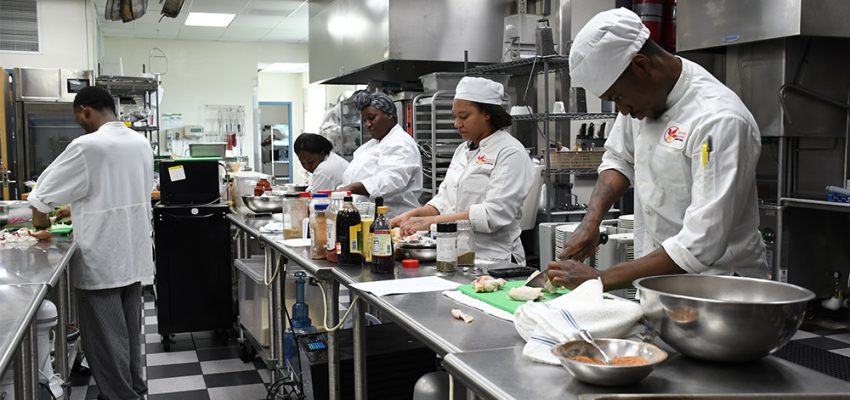 students working in a kitchen